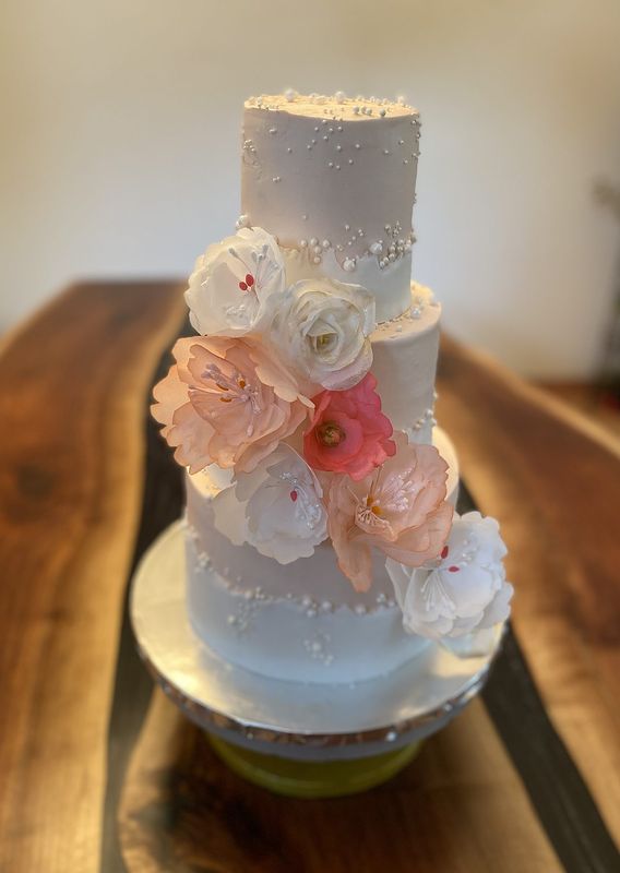Three-tier white egg-free wedding cake with handmade blush sugar flowers, Milwaukee WI